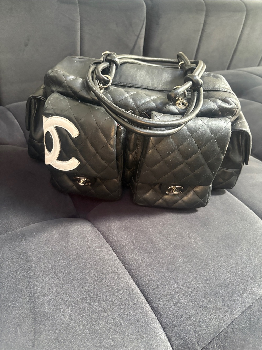 CHANEL Black Quilted Leather Double-Pocket Shoulder Bag with White CC Patch